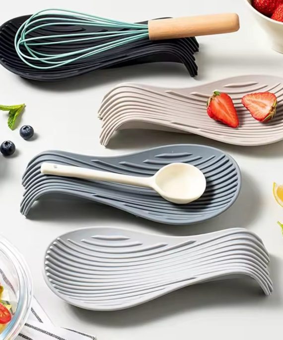 Flexible spoon rest for holding kitchen utensils and keeping countertops clean during cooking activities